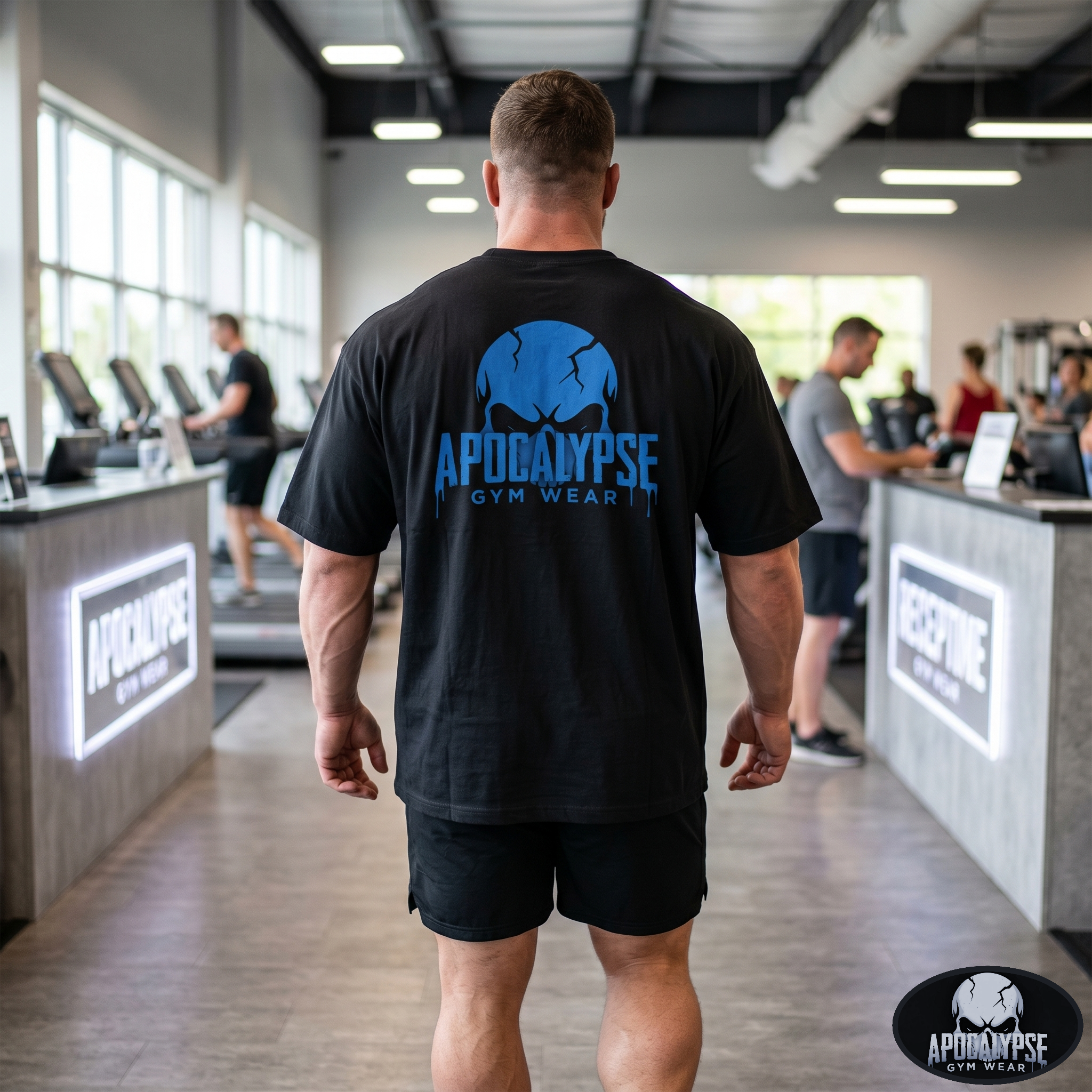 Apocalypse Gym Wear, Large, ink-heavy brand crest logo featuring a dark, mythic skull design with deep cross-hatching and fine linework textures, printed in high-contrast monochrome on the back of a vintage black, boxy heavyweight cotton t-shirt.