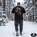 Apocalypse Gym Wear, Large, ink-heavy comic style illustration of the Norse god Thor with a horned helmet and long beard against a full moon, printed in high-contrast monochrome on the back of a vintage black, boxy heavyweight cotton t-shirt.
