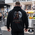 Apocalypse Gym Wear, Premium black relaxed-fit pullover gym hoodie pump cover featuring a massive back print of an armored Spartacus gladiator with a red cape and sword, framed against a giant full moon.