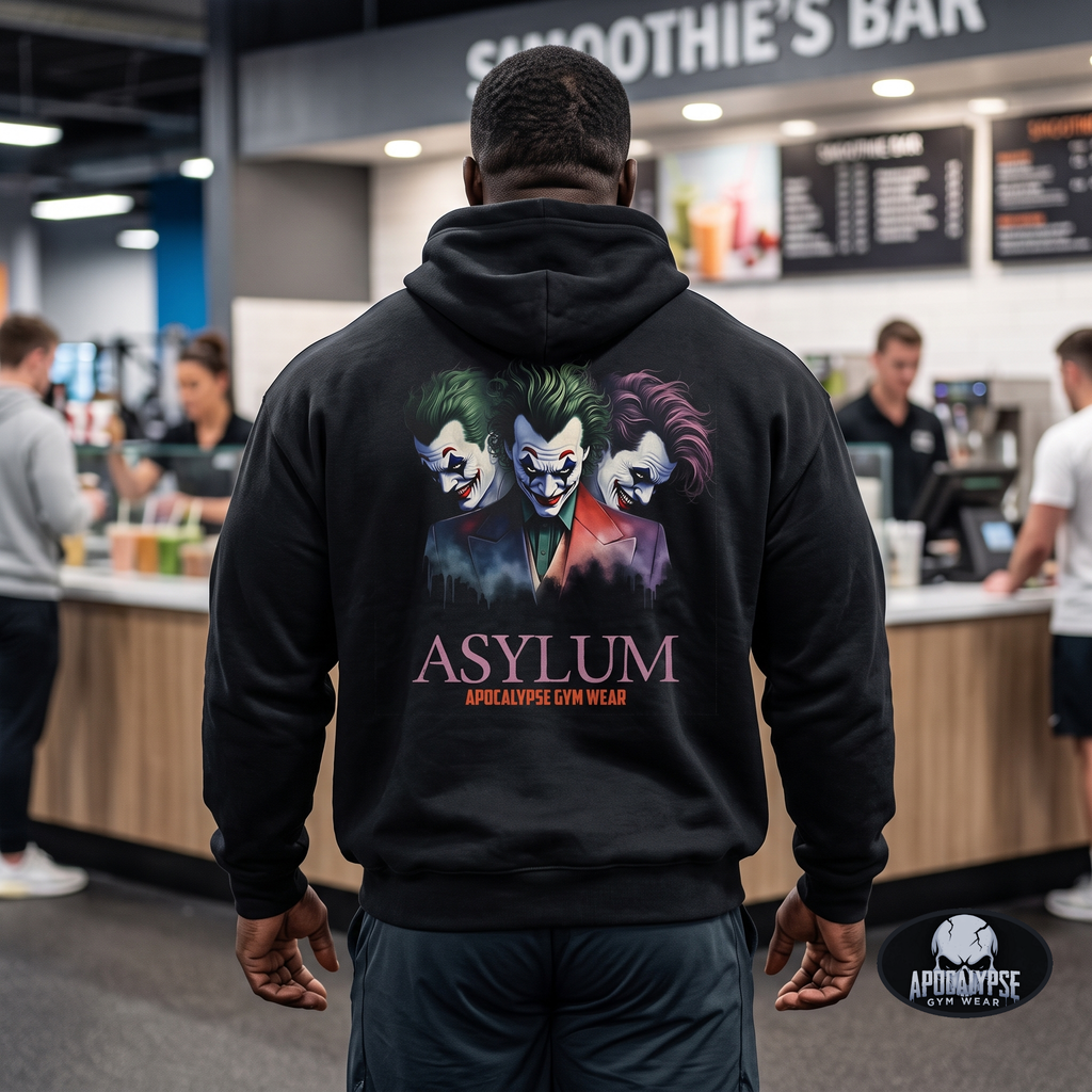 Apocalypse Gym Wear, Premium black relaxed-fit pullover gym hoodie pump cover featuring a massive back print of three chaotic, sinister split-personality faces fighting themselves above the word ASYLUM.