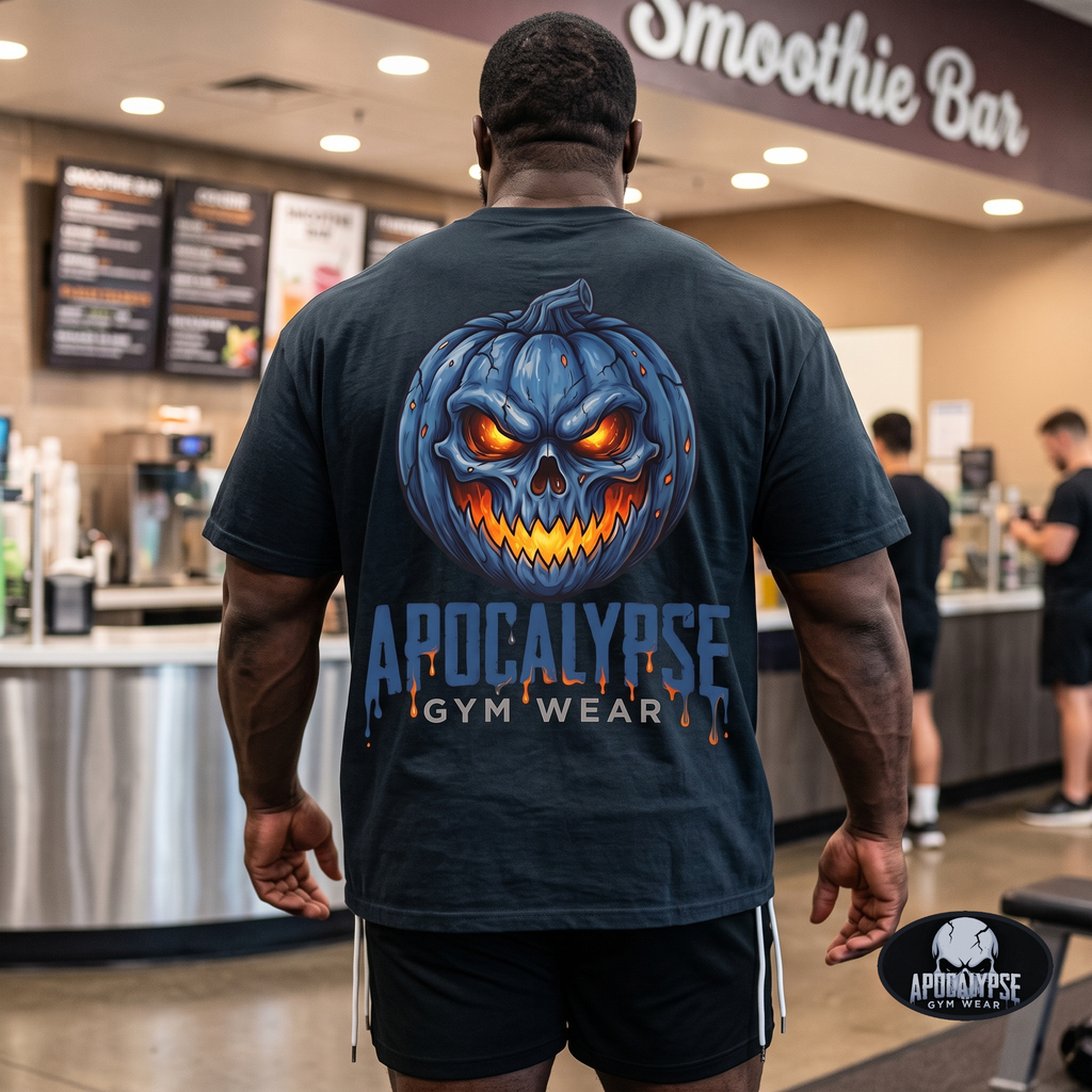 Apocalypse Gym Wear blue pumpkin skull black t-shirt worn by a bodybuilder in a gym. Back view showing a massive glowing orange and icy blue jack-o'-lantern back print.