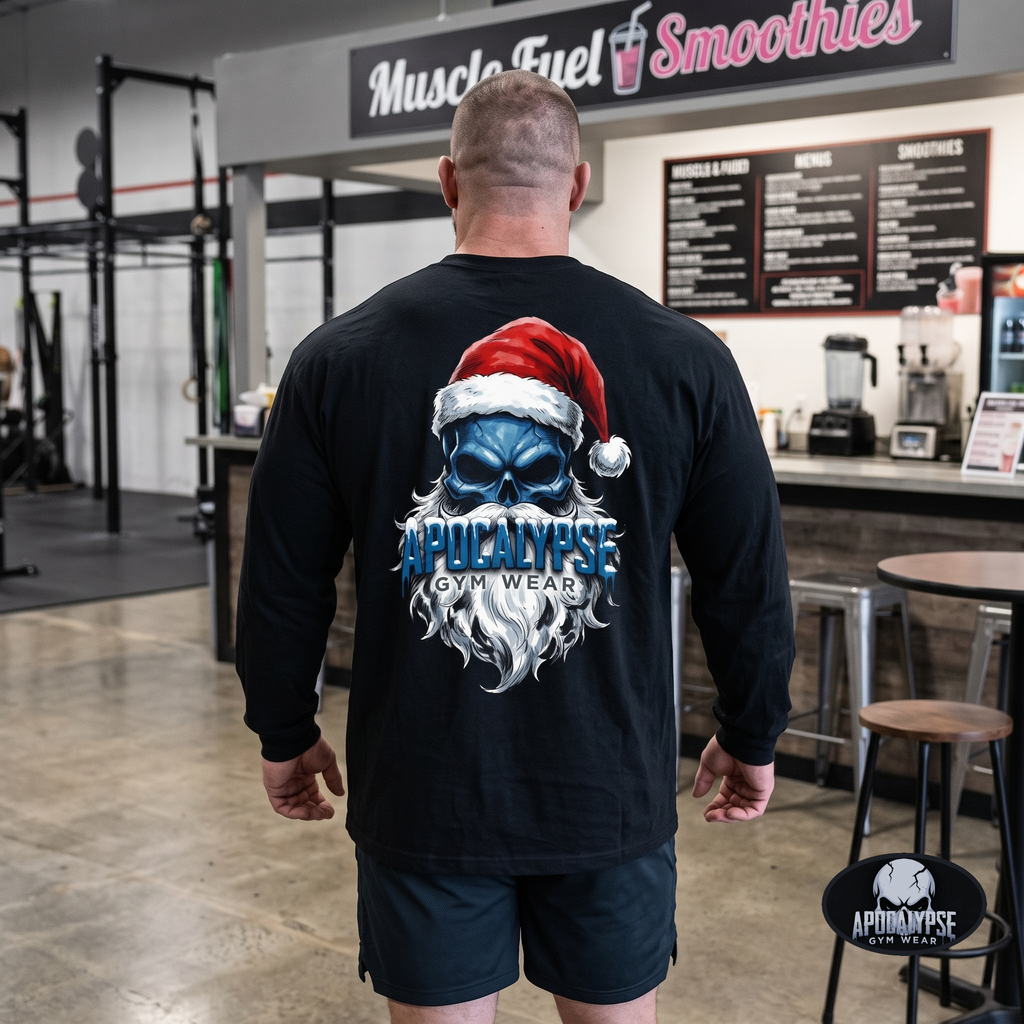 Apocalypse Gym Wear frozen Santa skull long sleeve black gym shirt worn by a bodybuilder. Back view showing an icy blue skull graphic with red Santa hat and frosted dripping typography.
