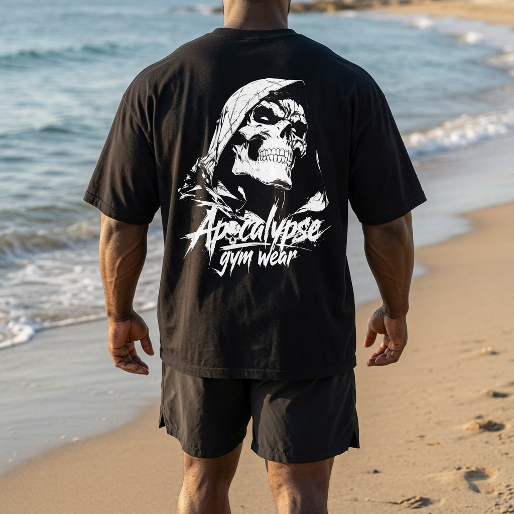 Apocalypse Gym Wear black and white hooded skull t-shirt back view worn by an athlete, showing a high-contrast white hooded skull back graphic with brand typography.