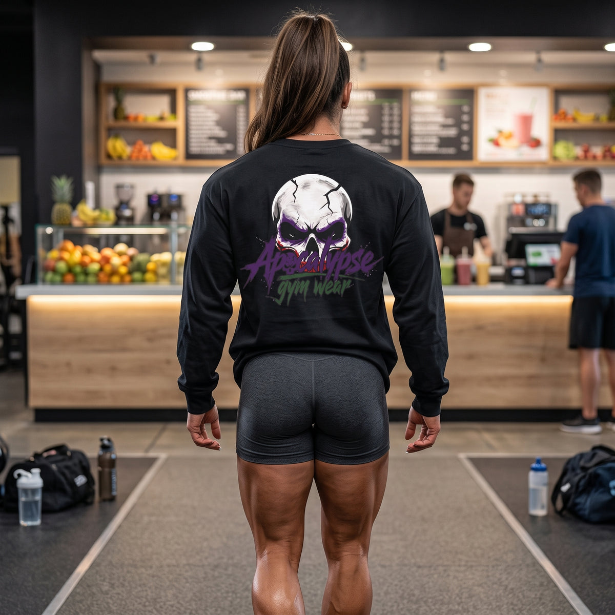Apocalypse Gym Wear Psychotic Jester black long sleeve t-shirt back view worn in a gym, featuring a jawless jester skull back print with brand typography.