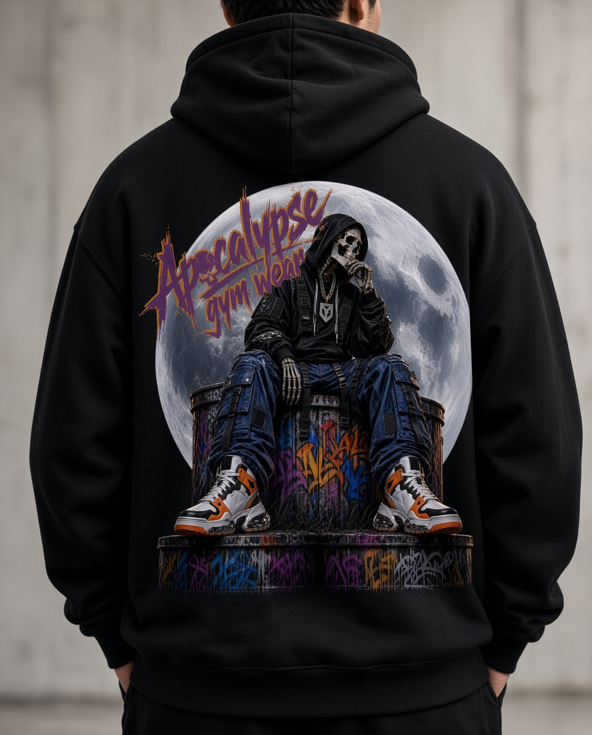 Close-up print detail of Apocalypse Gym Wear Lunar Reaper graphic featuring hooded skeleton and purple graffiti brush text on black fleece.