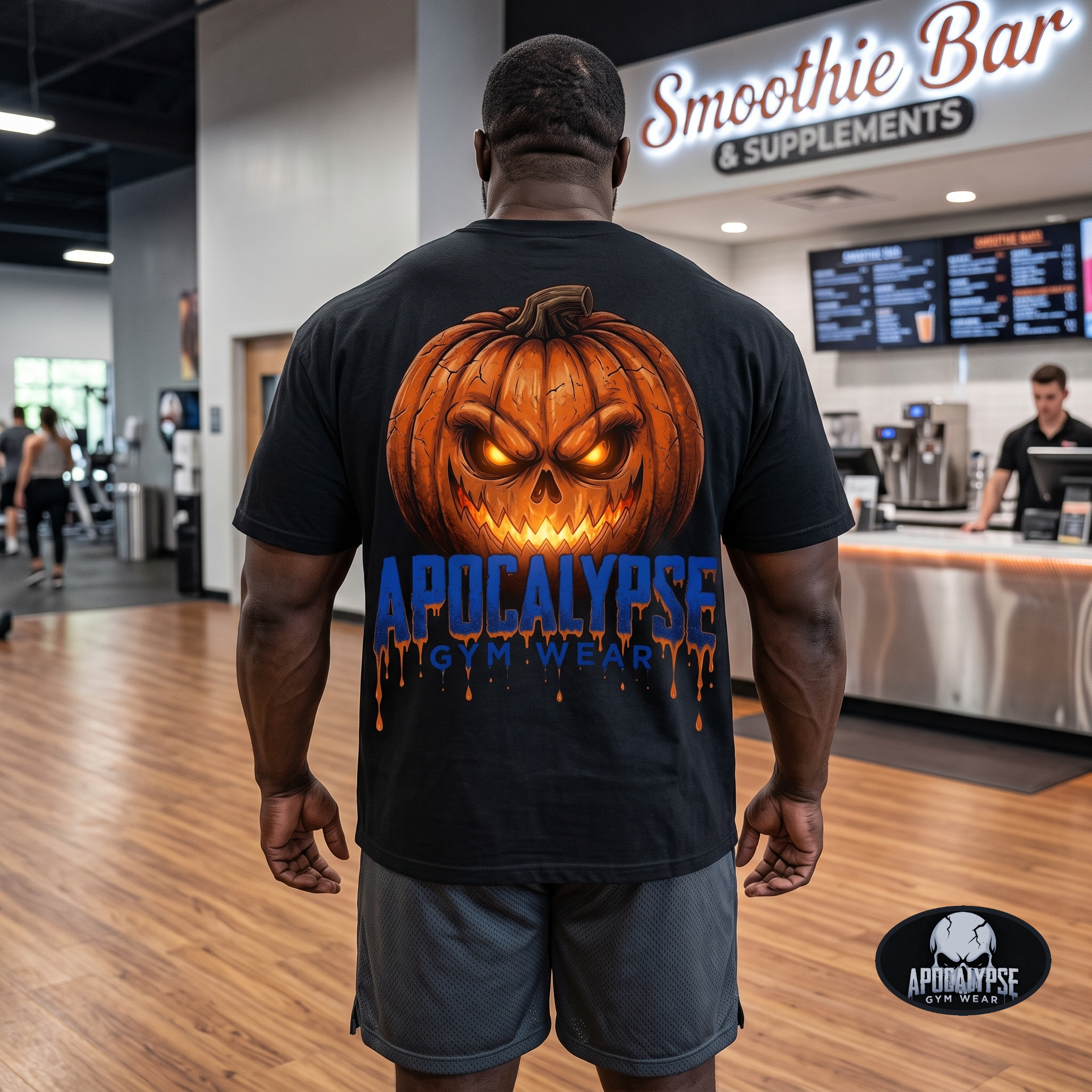 Apocalypse Gym Wear orange pumpkin skull black t-shirt worn by a bodybuilder in a gym. Back view showing a massive glowing jack-o'-lantern back print above blue dripping typography.